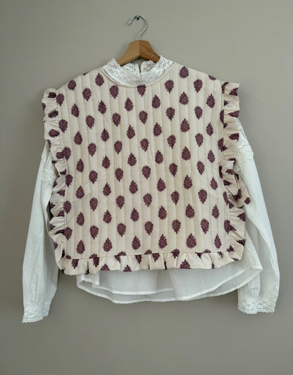 Plastron matelassé crème avec motifs violets et boutons dans le dos