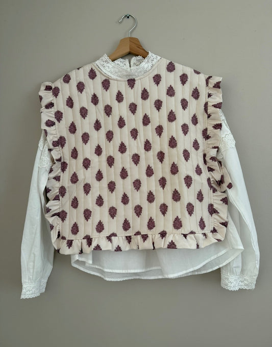 Plastron matelassé crème avec motifs violets et boutons dans le dos
