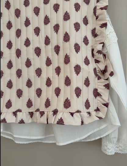 Plastron matelassé crème avec motifs violets et boutons dans le dos