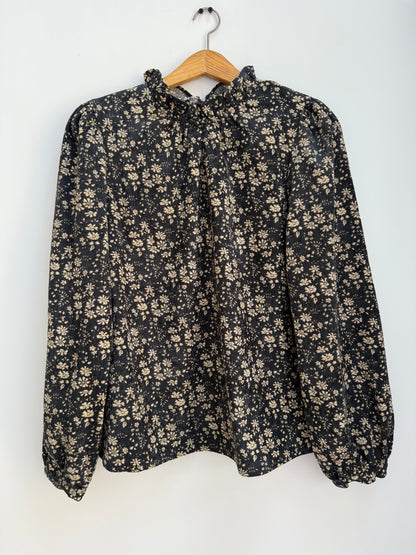 Blouse en velours noire avec motifs crème