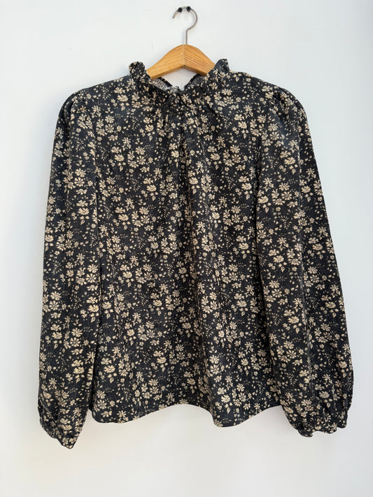 Blouse en velours noire avec motifs crème