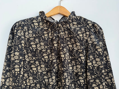 Blouse en velours noire avec motifs crème