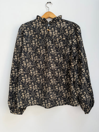 Blouse en velours noire avec motifs crème