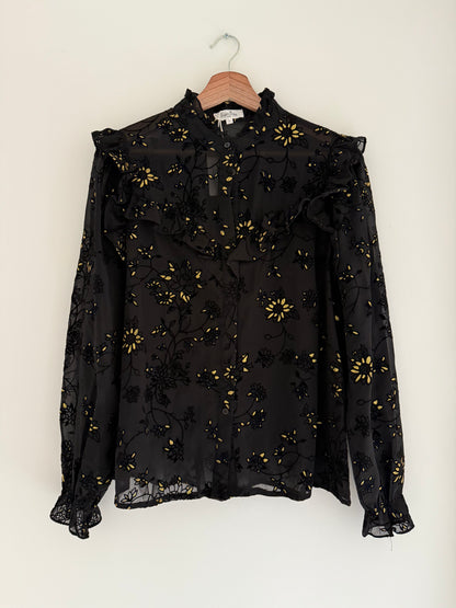 Blouse froufrous noire avec motifs en relief et détails dorés