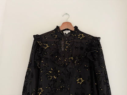 Blouse froufrous noire avec motifs en relief et détails dorés