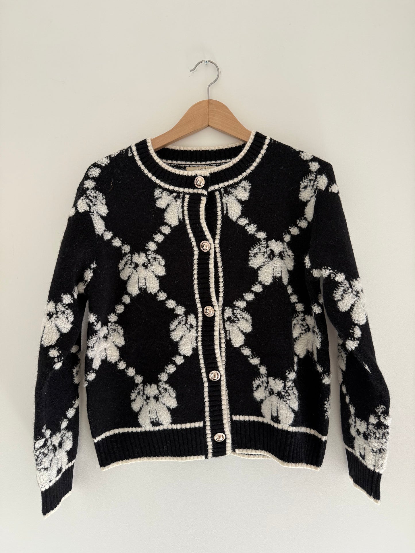 Gilet effet laine noir et blanc avec boutons dorés