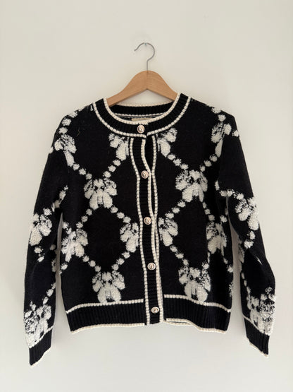 Gilet effet laine noir et blanc avec boutons dorés