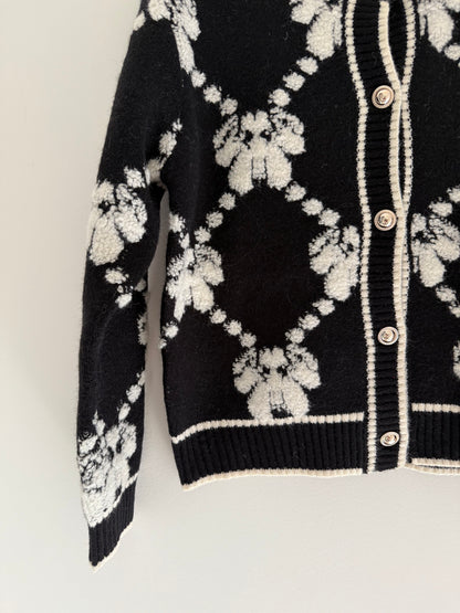 Gilet effet laine noir et blanc avec boutons dorés