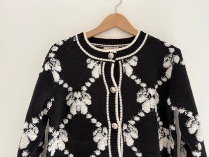 Gilet effet laine noir et blanc avec boutons dorés