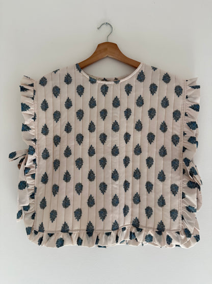 Plastron matelassé crème avec motifs bleus et boutons dans le dos&nbsp;