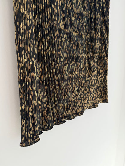 Jupe longue coupe droite plissée noire avec motifs dorés