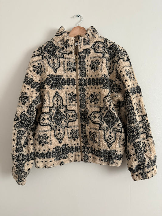 Veste polaire a bouclettes crème avec motifs noirs