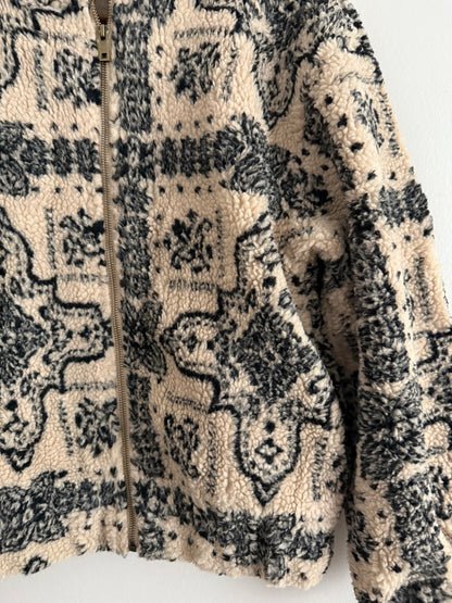 Veste polaire a bouclettes crème avec motifs noirs