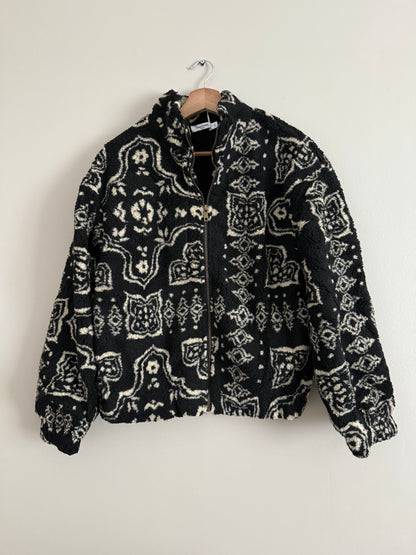 Veste polaire à bouclettes crème avec motifs beiges