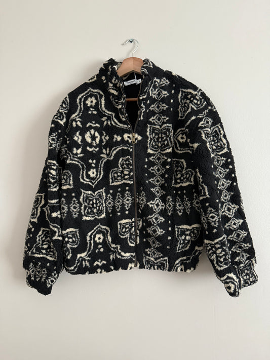 Veste polaire à bouclettes crème avec motifs beiges